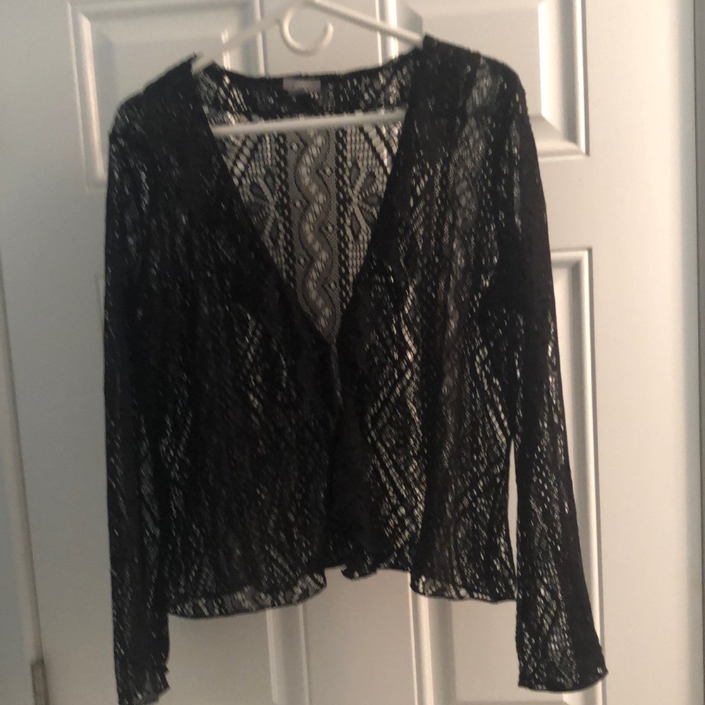 This is a bolero lace jacket with a clasp in the front.  Never used
